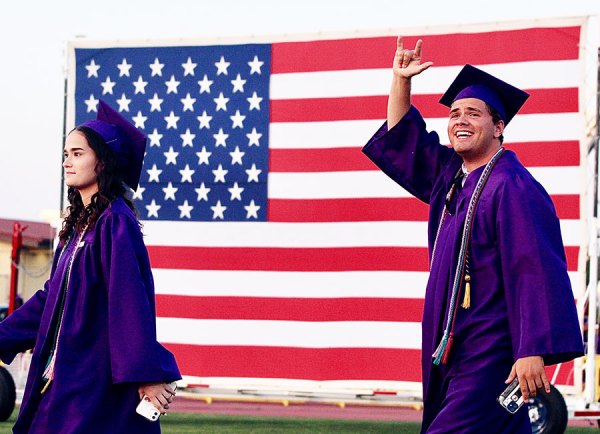 Lemoore High grads wave to family and friends.